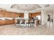 Spacious kitchen featuring an island with seating, wooden cabinetry, and stainless steel appliances at 10649 E Saddle Blanket Trl, Gold Canyon, AZ 85118