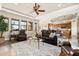 Open-concept living room with kitchen access and plentiful natural light at 10649 E Saddle Blanket Trl, Gold Canyon, AZ 85118