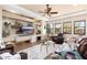 Cozy living room with custom built-ins, fireplace, and ample seating at 10649 E Saddle Blanket Trl, Gold Canyon, AZ 85118