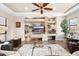 Bright living room with custom shelving, recessed lighting and stylish decor at 10649 E Saddle Blanket Trl, Gold Canyon, AZ 85118