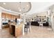 Open-concept living room and kitchen feature granite countertops and tile flooring at 10649 E Saddle Blanket Trl, Gold Canyon, AZ 85118