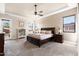 Spacious main bedroom featuring a ceiling fan, carpet, and natural light at 10649 E Saddle Blanket Trl, Gold Canyon, AZ 85118
