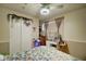 Cozy bedroom featuring a decorative bedspread, vanity area, and closet space at 11509 E Marguerite Ave, Mesa, AZ 85208