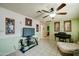 Spacious living room featuring a ceiling fan, tile floors, and neutral-toned walls at 11509 E Marguerite Ave, Mesa, AZ 85208