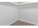 Clean basement with light wood floors, white walls, and modern trim molding at 11671 S Jokake St, Phoenix, AZ 85044