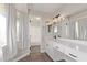 Neutral bathroom design with plenty of counter space, large mirror, and natural light at 11671 S Jokake St, Phoenix, AZ 85044