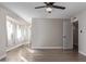 Bright, spacious bedroom with multiple windows, light wood floors, and neutral colored walls at 11671 S Jokake St, Phoenix, AZ 85044