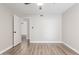 Spacious bedroom features neutral walls, modern ceiling fan and an open doorway at 11671 S Jokake St, Phoenix, AZ 85044
