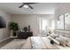 Stylishly decorated main bedroom with accent rug, fan, and bay window for lots of light at 11671 S Jokake St, Phoenix, AZ 85044