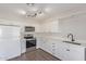 Bright kitchen with white cabinets, stainless steel appliances and dark hardware at 11671 S Jokake St, Phoenix, AZ 85044