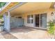 Cozy patio with a view of sliding glass doors and a glimpse of the neighborhood at 11671 S Jokake St, Phoenix, AZ 85044
