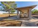 Outdoor picnic pavilion with multiple tables and ample space for community gatherings and Gathering outings at 11671 S Jokake St, Phoenix, AZ 85044