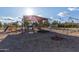 Bright and fun community playground with shade cover, multiple play structures, and swings on a sunny day at 11671 S Jokake St, Phoenix, AZ 85044
