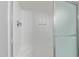 Clean, updated shower with a sliding glass door and built-in seating at 11671 S Jokake St, Phoenix, AZ 85044