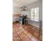 Well-lit kitchen featuring tile flooring, an oven, and a window, offering a cozy cooking space at 1309 W Glenrosa Ave, Phoenix, AZ 85013