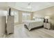 Relaxing bedroom with many windows with plantation shutters and light, neutral color palette at 14000 N 94Th St # 2144, Scottsdale, AZ 85260