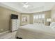 Bright primary bedroom showcasing a neutral color palette, tray ceilings, and many windows at 14000 N 94Th St # 2144, Scottsdale, AZ 85260