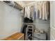 Organized walk-in closet with shelving, hanging rods, and storage containers for maximum storage solutions at 14000 N 94Th St # 2144, Scottsdale, AZ 85260