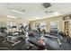 Well-equipped gym with various machines, weights, and ceiling fans for a comfortable workout environment at 14000 N 94Th St # 2144, Scottsdale, AZ 85260