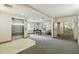 Hallway with a silver elevator, a cozy desk area, and neutral decor leading to a well-lit hallway at 14000 N 94Th St # 2144, Scottsdale, AZ 85260