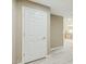 Hallway with white painted door that complements the light, neutral paint and bright flooring at 14000 N 94Th St # 2144, Scottsdale, AZ 85260