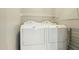 Laundry area features a white side-by-side washer and dryer with a wire shelf above at 14000 N 94Th St # 2144, Scottsdale, AZ 85260