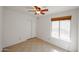 Bright bedroom features tile floors, a ceiling fan, and a window at 14401 N 22Nd St, Phoenix, AZ 85022