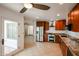 Open kitchen layout with stainless steel appliances, granite countertops, and backyard access at 14401 N 22Nd St, Phoenix, AZ 85022