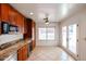 Open kitchen with stainless steel appliances, granite countertops, wine fridge and backyard access at 14401 N 22Nd St, Phoenix, AZ 85022
