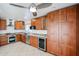 Well-equipped kitchen featuring stainless steel appliances and custom wood cabinetry and tile floors at 14401 N 22Nd St, Phoenix, AZ 85022