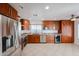 Gourmet kitchen with stainless steel appliances, granite countertops, and custom wood cabinetry at 14401 N 22Nd St, Phoenix, AZ 85022