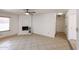 Inviting living room featuring a white brick fireplace and neutral tile floors at 14401 N 22Nd St, Phoenix, AZ 85022