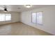 Bright living space featuring neutral tile floors and large windows with window treatments at 14401 N 22Nd St, Phoenix, AZ 85022