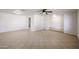 Open-concept living space with neutral tile flooring and ample natural light at 14401 N 22Nd St, Phoenix, AZ 85022