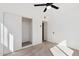 This bedroom features an open closet, a ceiling fan and ample natural light at 1621 W Mulberry Dr, Phoenix, AZ 85015