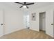 Cozy bedroom with neutral carpet, ceiling fan, closet and a modern door at 1621 W Mulberry Dr, Phoenix, AZ 85015