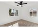 A bright bedroom features a large window providing outdoor views and allowing natural light to fill the space at 1621 W Mulberry Dr, Phoenix, AZ 85015