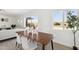 Dining room featuring a modern wood table, stylish chairs, and lots of natural light at 1621 W Mulberry Dr, Phoenix, AZ 85015