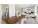 Dining room featuring a modern wood table, stylish chairs, and decor with stainless steel appliances in the background at 1621 W Mulberry Dr, Phoenix, AZ 85015