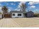 Stylish single-story home featuring a convenient carport and desert landscaping at 1621 W Mulberry Dr, Phoenix, AZ 85015