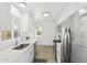 Modern kitchen with white cabinets, stainless steel appliances, and a bright, clean aesthetic at 1621 W Mulberry Dr, Phoenix, AZ 85015