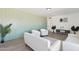Inviting living room featuring modern decor, a stylish accent wall and lots of natural light at 1621 W Mulberry Dr, Phoenix, AZ 85015