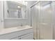 Clean bathroom featuring vanity with sink and a shower with sliding glass doors at 17200 W Bell Rd # 77, Surprise, AZ 85374