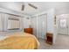 This bedroom offers neutral colors and a view to the exterior at 17200 W Bell Rd # 77, Surprise, AZ 85374