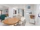 Bright dining area with wood table and chairs adjacent to the kitchen for easy serving and entertaining at 17200 W Bell Rd # 77, Surprise, AZ 85374