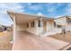 Charming single-story home with covered parking and cozy front porch in a well-maintained community at 17200 W Bell Rd # 77, Surprise, AZ 85374