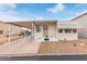 Charming single-story home with covered parking and cozy front porch in a well-maintained community at 17200 W Bell Rd # 77, Surprise, AZ 85374