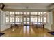 Bright game room featuring ping pong tables, wood floors, and ample natural light from the large windows at 17200 W Bell Rd # 77, Surprise, AZ 85374