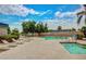 Community pool area with lounge chairs and well-kept landscaping at 17200 W Bell Rd # 77, Surprise, AZ 85374