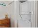 Conveniently placed stacked washer and dryer offer easy laundry access in the bedroom closet at 17200 W Bell Rd # 77, Surprise, AZ 85374